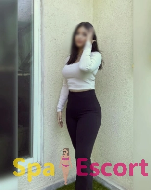 Confident escort model with long hair offering girlfriend experience.